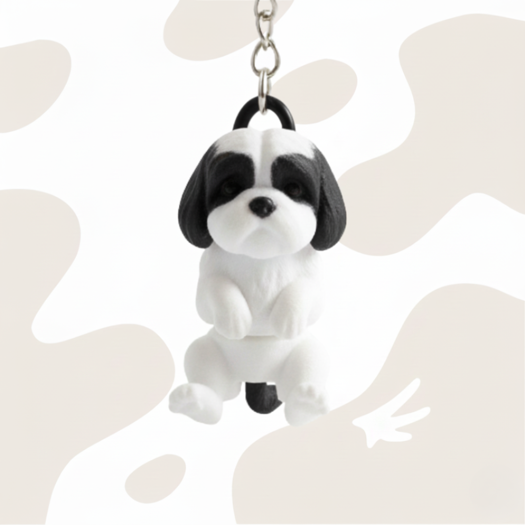 Brelok w kształcie psa rasy Shih Tzu, czarno-biały, wykonany w technologii druku 3D. Idealny jako gadżet lub prezent.