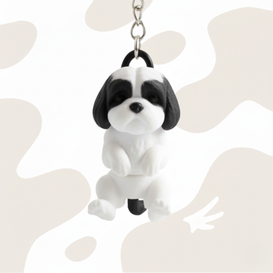 Brelok w kształcie psa rasy Shih Tzu, czarno-biały, wykonany w technologii druku 3D. Idealny jako gadżet lub prezent.